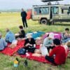 Meektrails safaris tourist on a picninc lunch in the Masai Mara
