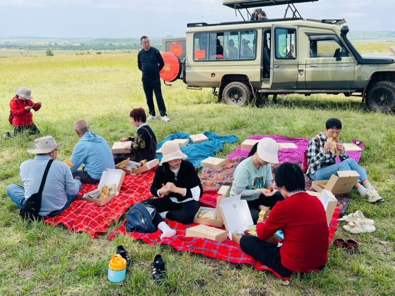 Meektrails safaris tourist on a picninc lunch in the Masai Mara
